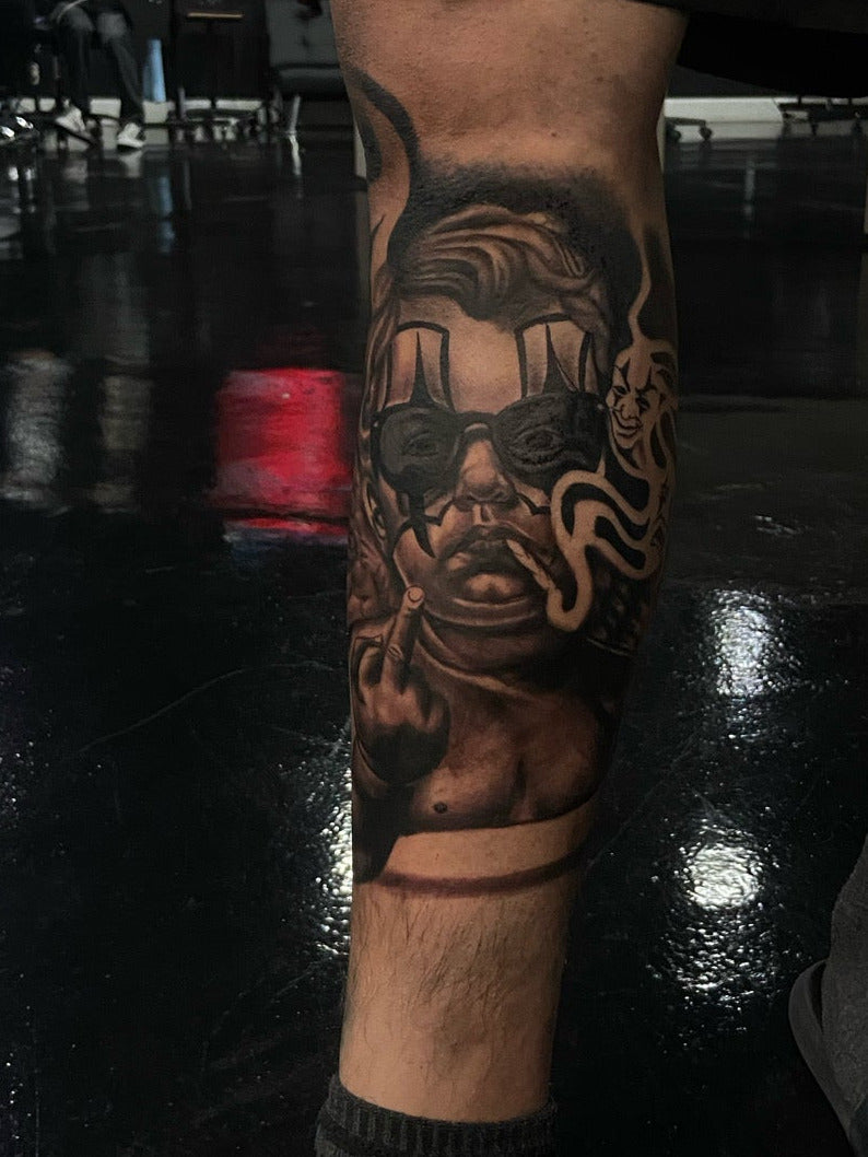 Black and grey chicano style leg tattoo
