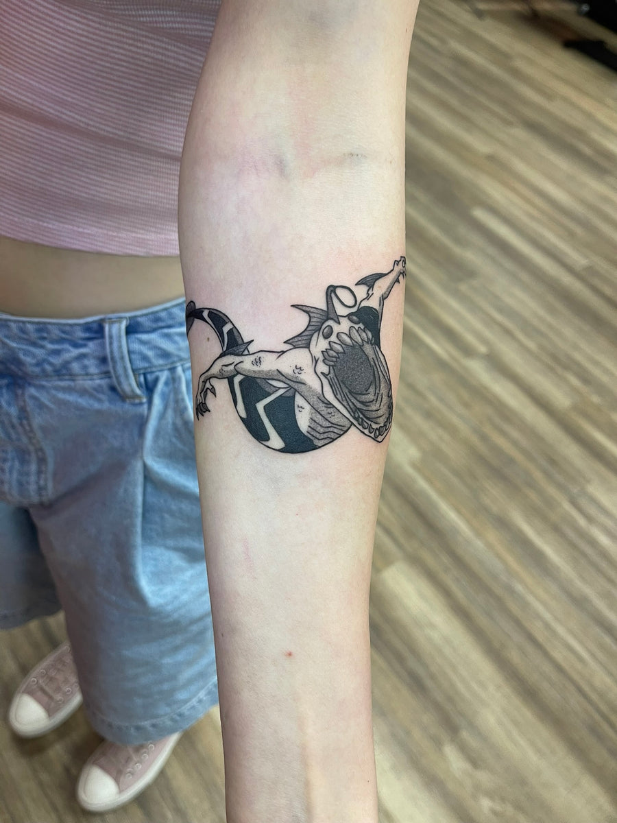 Fine line bat tattoo on the forearm