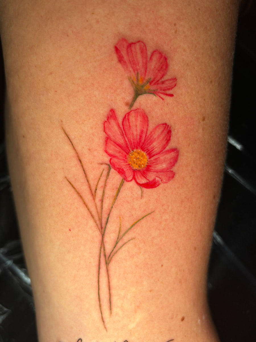 Color pink cosmos flower tattoo done at Tagz Tattoo in Mesa, AZ