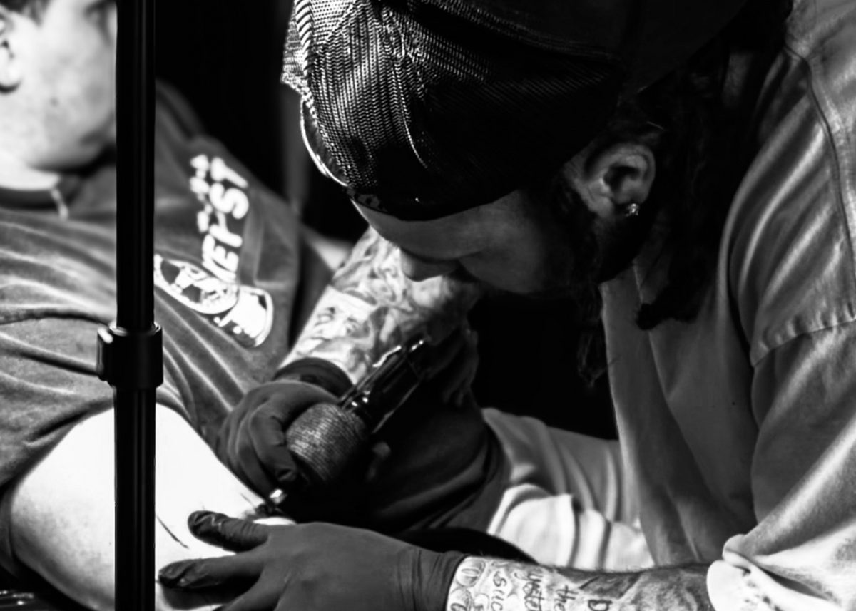 AG tattooing a client at Tagz Tattoo in Mesa, AZ