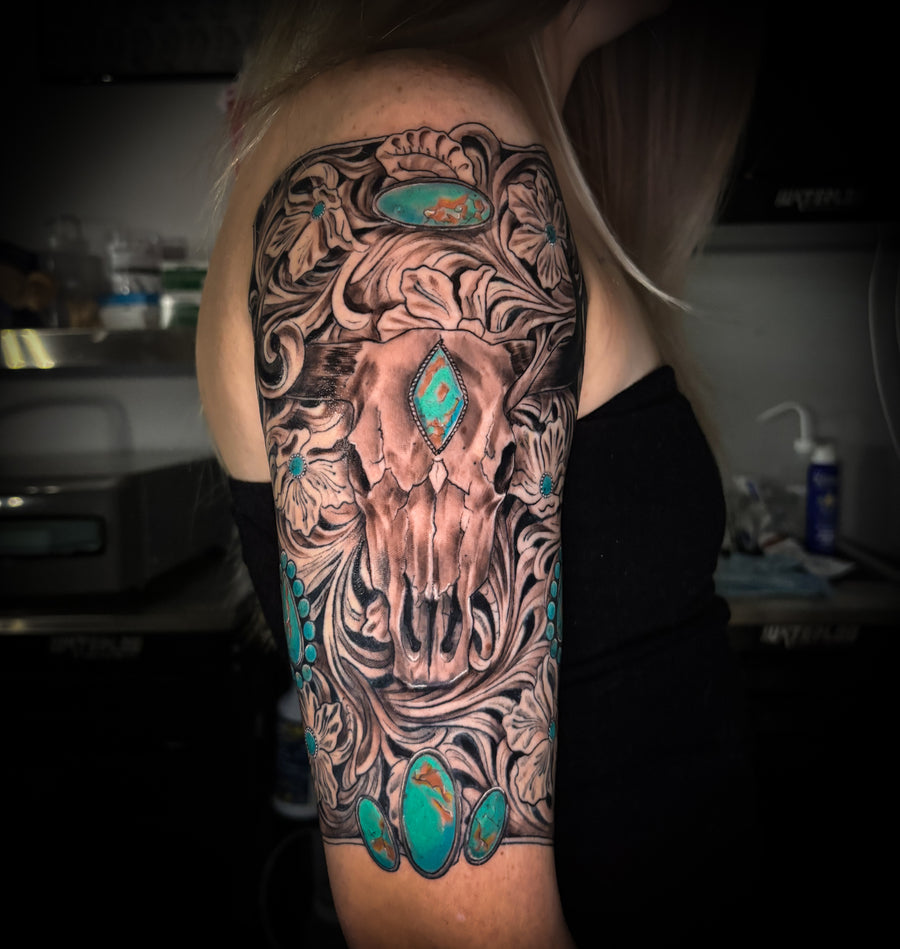 Ornamental skull half sleeve with turquoise accents
